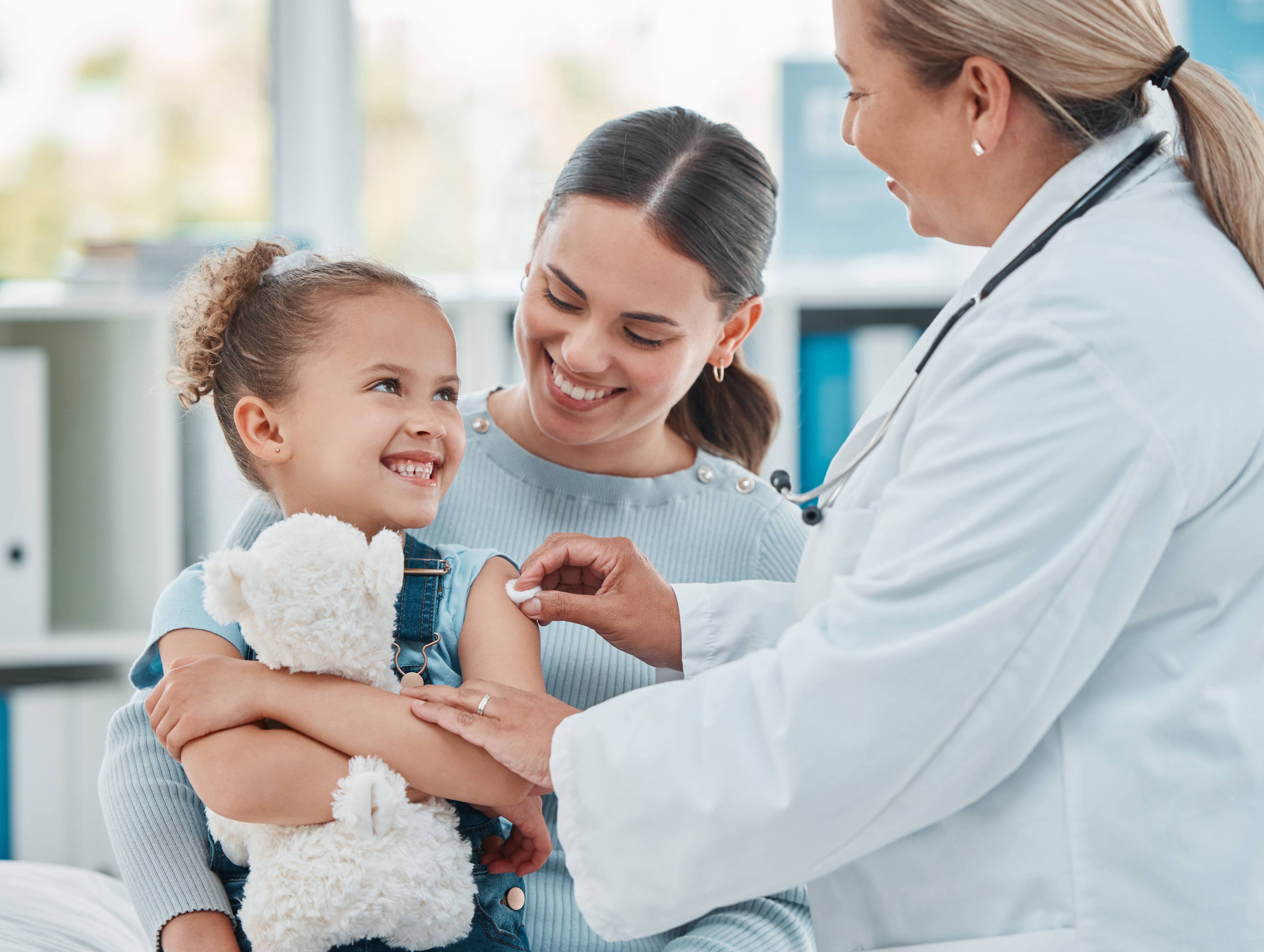 Parent checking temperature of sick child