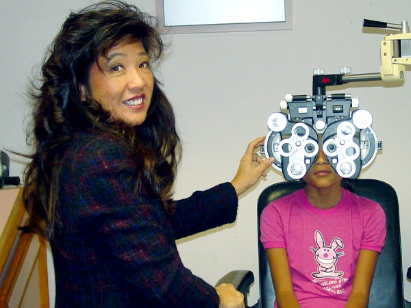 Optometrist with child patient